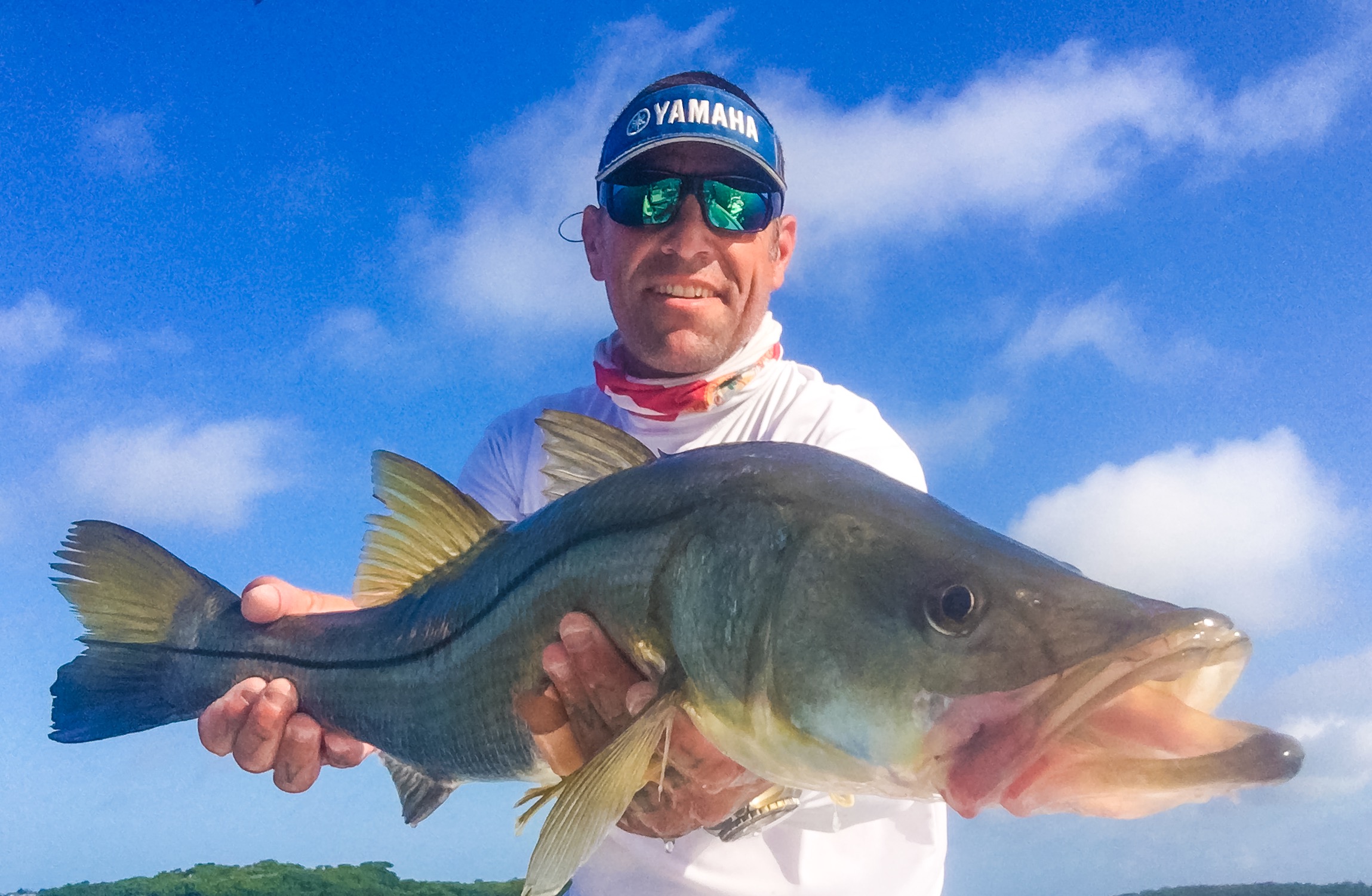 a bradenton fishing guide holding a snook