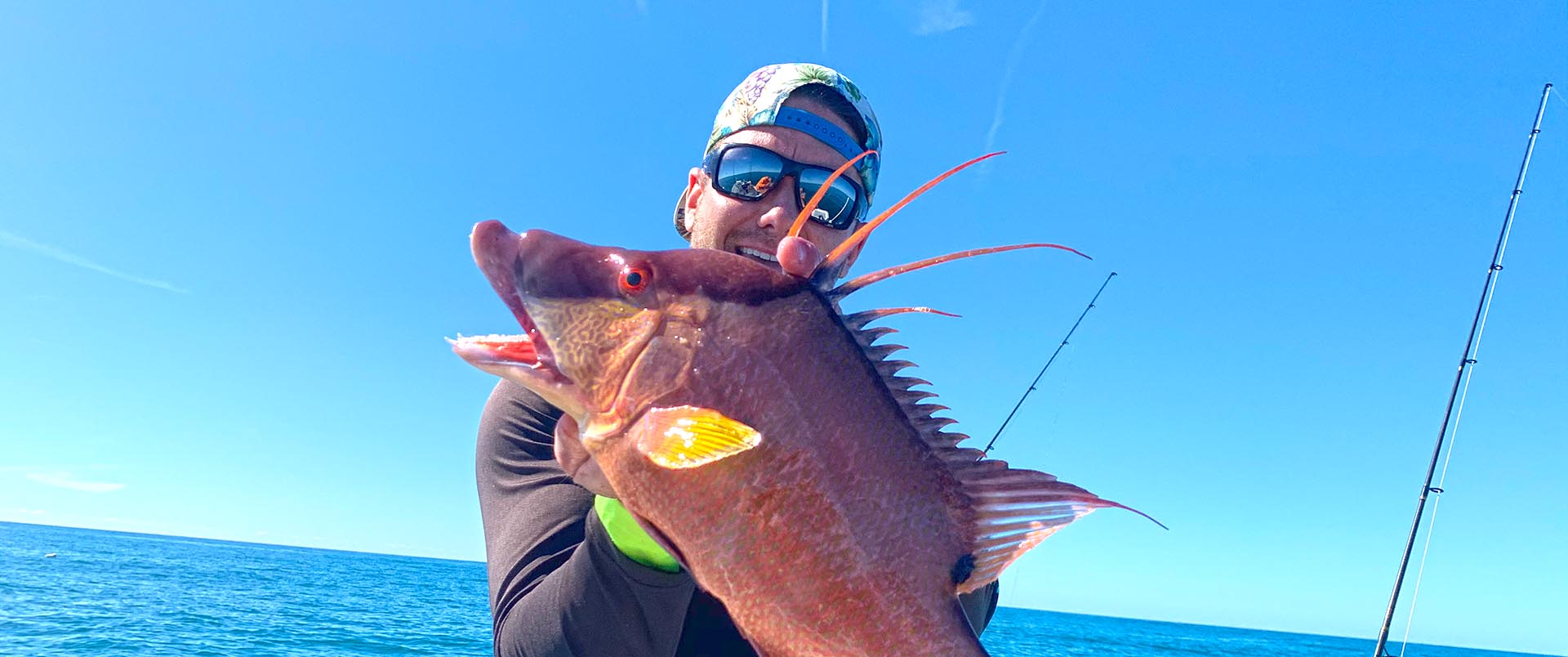 a fisherman with a hogfish